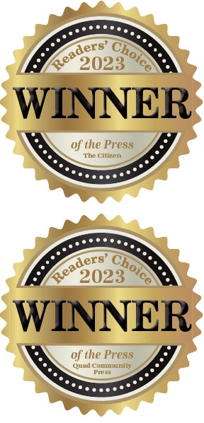 Two gold and black award badges labeled Readers Choice 2023 WINNER—one for The Citizen and one for Quad Community Press, both with of the Press written underneath.